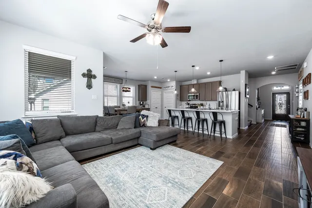 a living room with furniture and a table