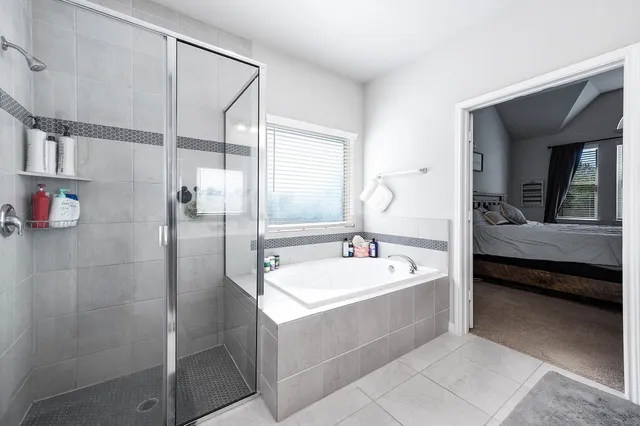 a spacious bathroom with a sink and mirror