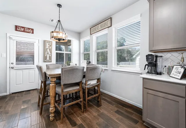 a view of a dining room with furniture window and outside view