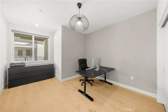 a view of a room with a table and chairs
