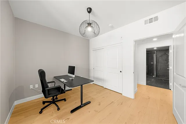 a bathroom with a double vanity sink toilet mirror and shower