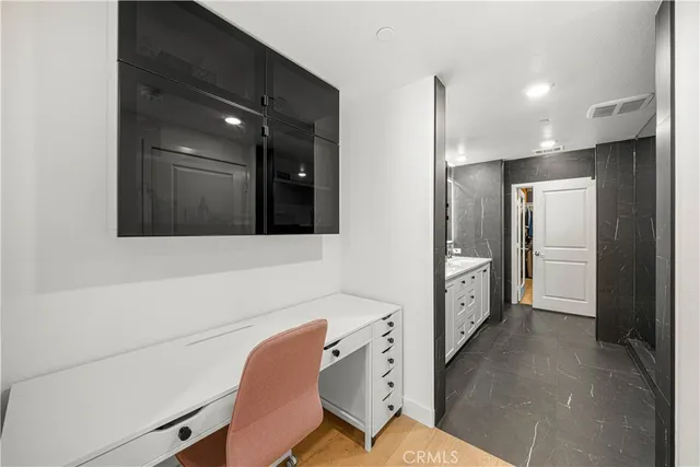 a bathroom with double vanity and a shower