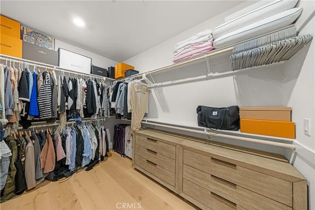 a view of an empty walk in closet with empty racks