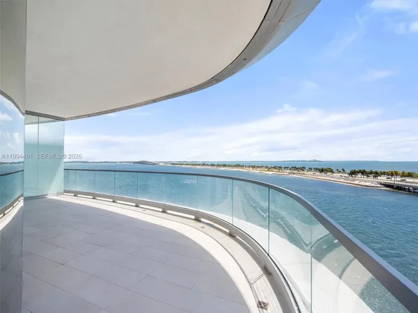 a view of a balcony with an ocean view