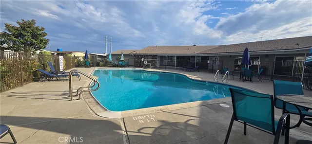 a view of a house with a big yard and large trees