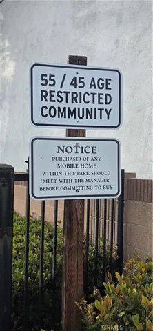 a view of a cars park in front of a building