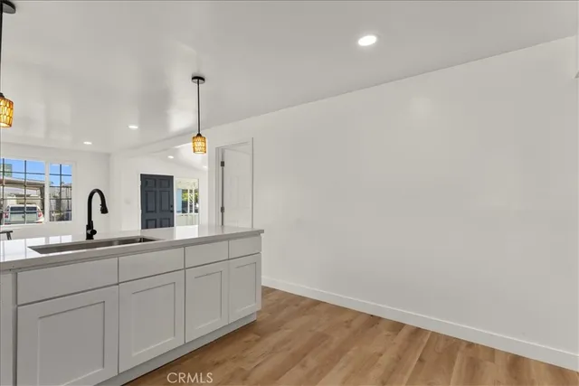 a kitchen with a sink and cabinets