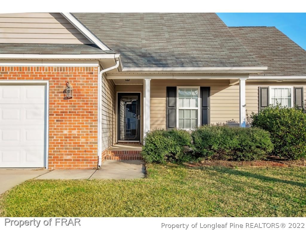1957 Yellowbrick Road Fayetteville, NC 28314 - Photo 4 of 27 a front view of a house with a yard