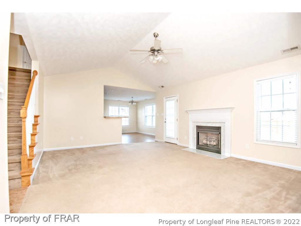 1957 Yellowbrick Road Fayetteville, NC 28314 - Photo 6 of 27 a view of empty room with a fireplace
