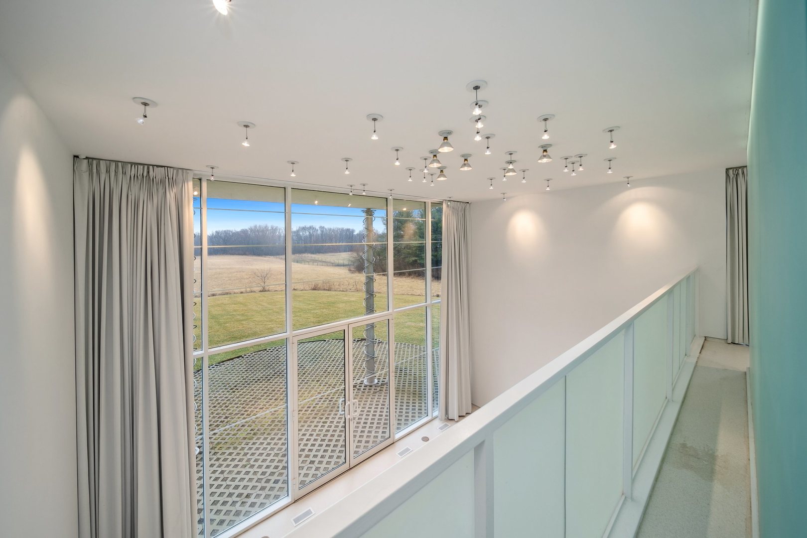 18303 Lincoln Road Harvard, IL 60033 - Photo 20 of 35 a view of a hallway with a chandelier