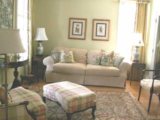 7705 Wilderness Road Raleigh, NC 27613 - Photo 4 of 10 a living room with furniture and a window