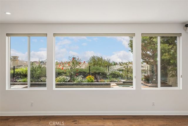 a front view of a house with a large window and front door