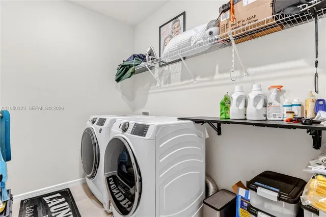 a utility room with dryer and washer