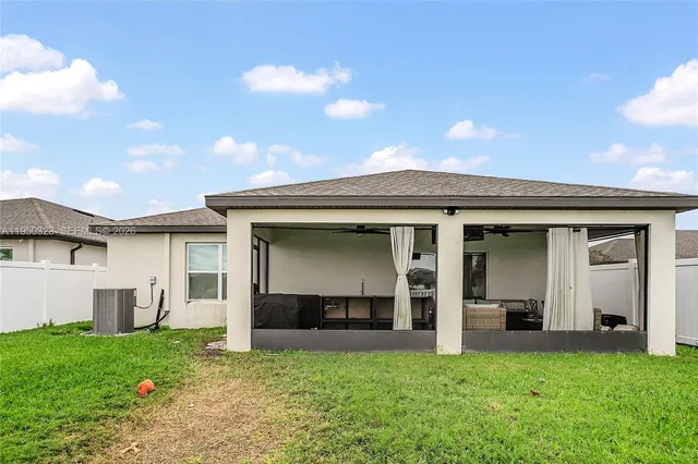 a view of an house with backyard porch and entertaining space