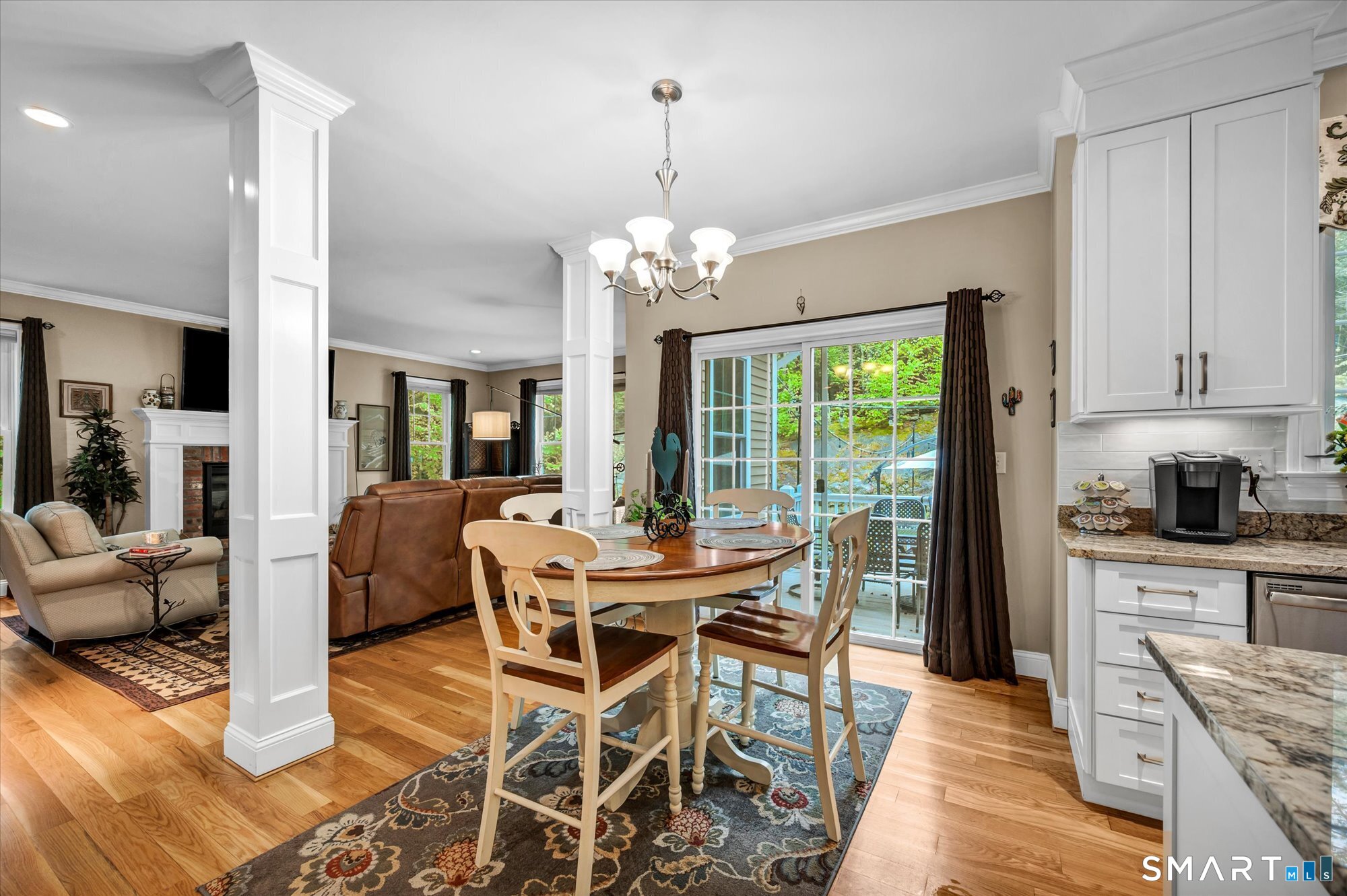 16 Sweetheart Mountain Road Canton, CT 06019 - Photo 12 of 40 a dining room with furniture a chandelier and wooden floor