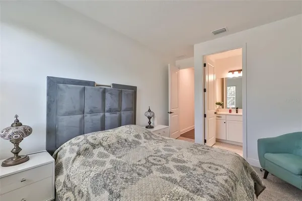 a bedroom with a bed and a dresser