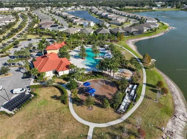 an aerial view of a house with a lake view