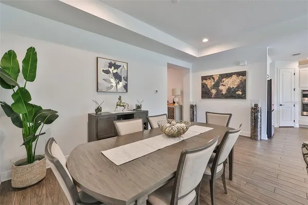 a view of a dining room with furniture window and wooden floor