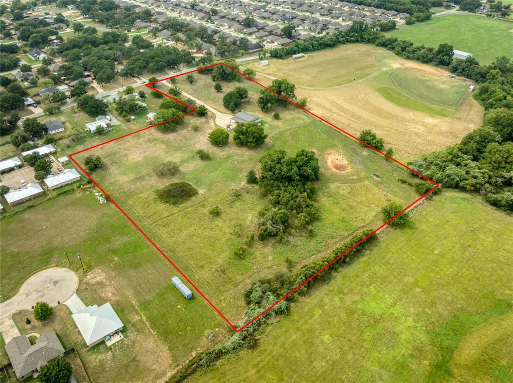 210 Spring Branch Trail North Springtown, TX 76082 - Photo 33 of 36 Expansive land parcel featuring a main residence, mature trees, open grassy areas, and a defined boundary line