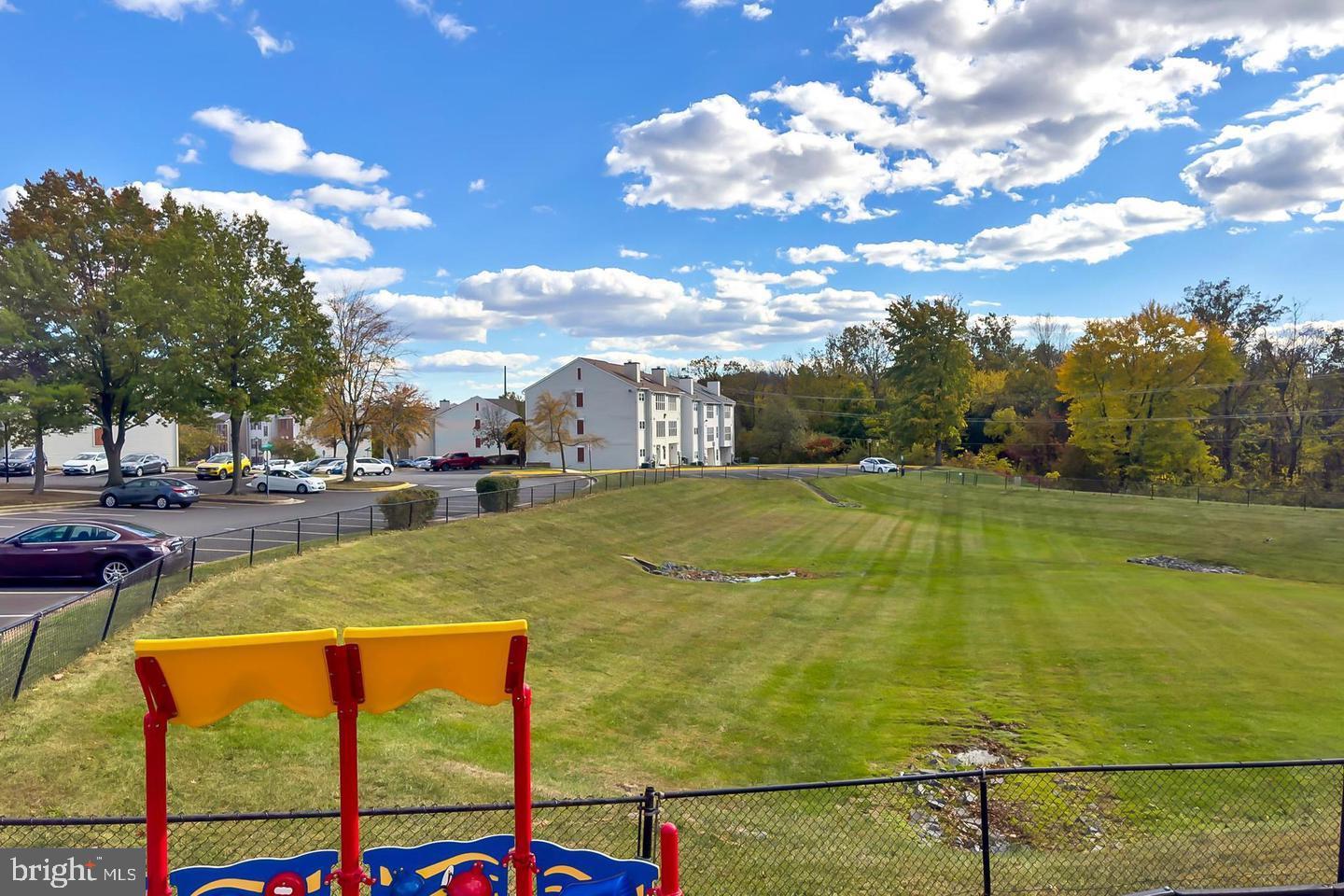 110 Prosperity Avenue Southeast, Unit D Leesburg, VA 20175 - Photo 24 of 25 a view of an outdoor space and swimming pool