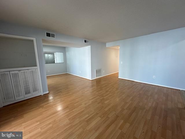 110 Prosperity Avenue Southeast, Unit D Leesburg, VA 20175 - Photo 4 of 25 a view of empty room with wooden floor