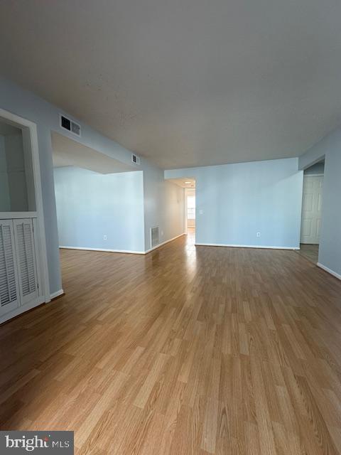 110 Prosperity Avenue Southeast, Unit D Leesburg, VA 20175 - Photo 6 of 25 a view of an empty room and wooden floor