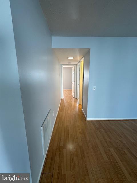 110 Prosperity Avenue Southeast, Unit D Leesburg, VA 20175 - Photo 9 of 25 a view of a hallway with wooden floor