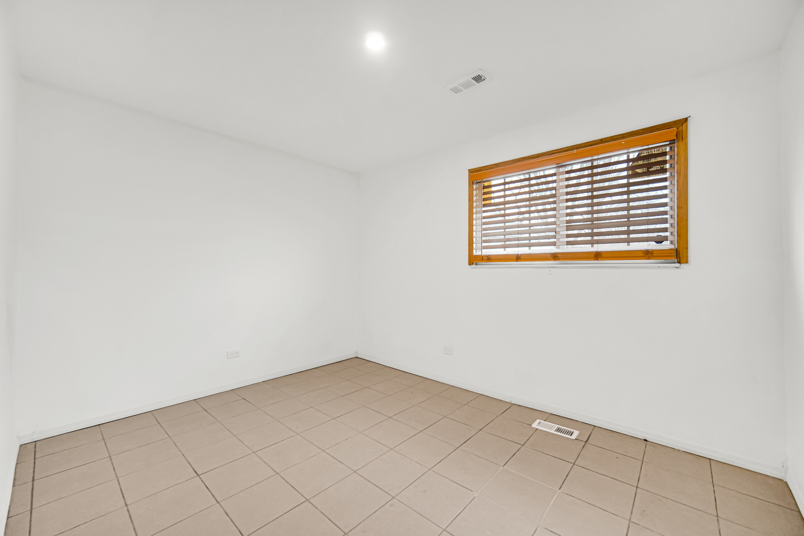 341 Boston Street North Chicago Heights, IL 60411 - Photo 12 of 13 a view of an empty room with a window