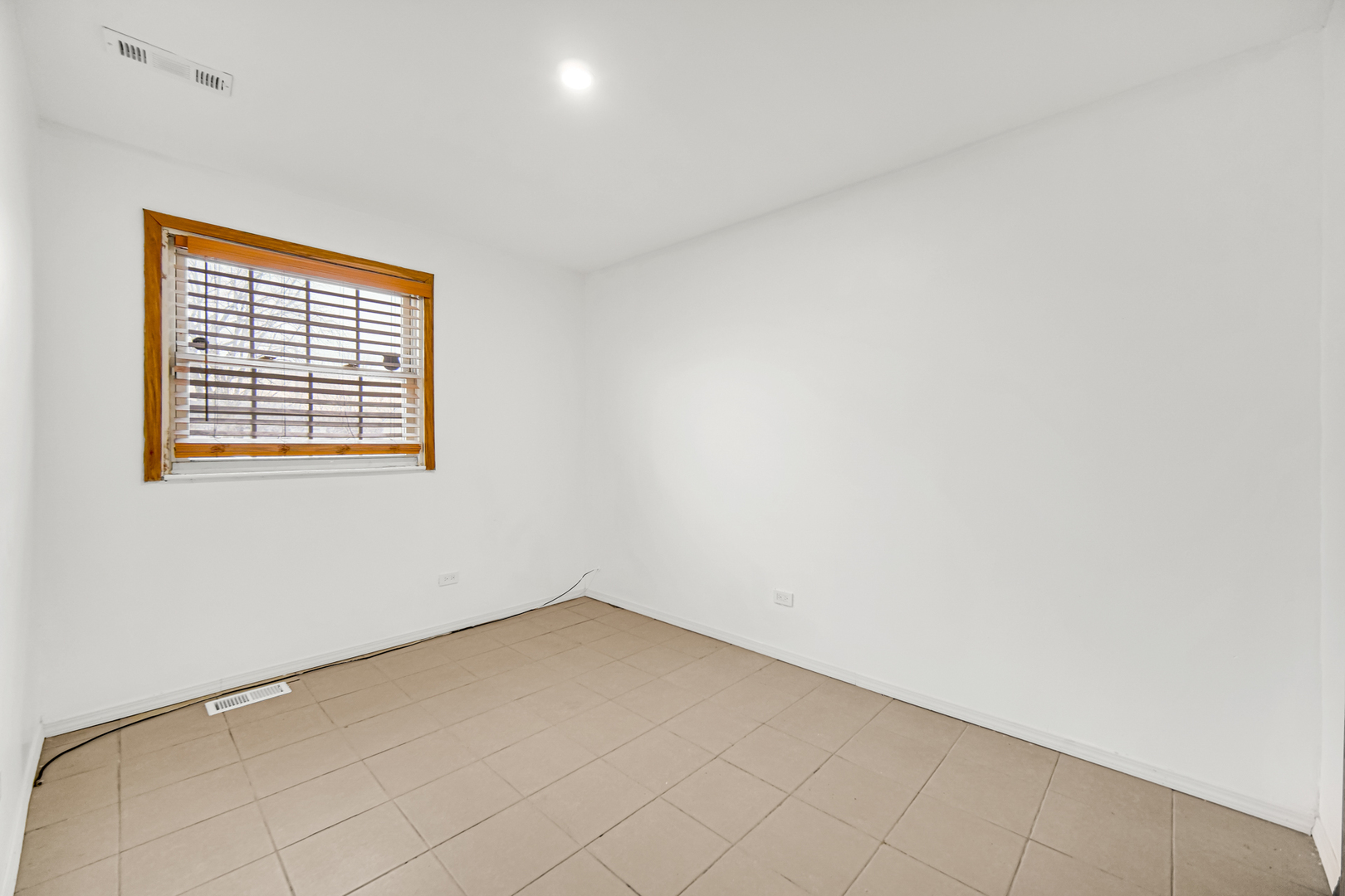 341 Boston Street North Chicago Heights, IL 60411 - Photo 13 of 13 an empty room with a empty space and a window