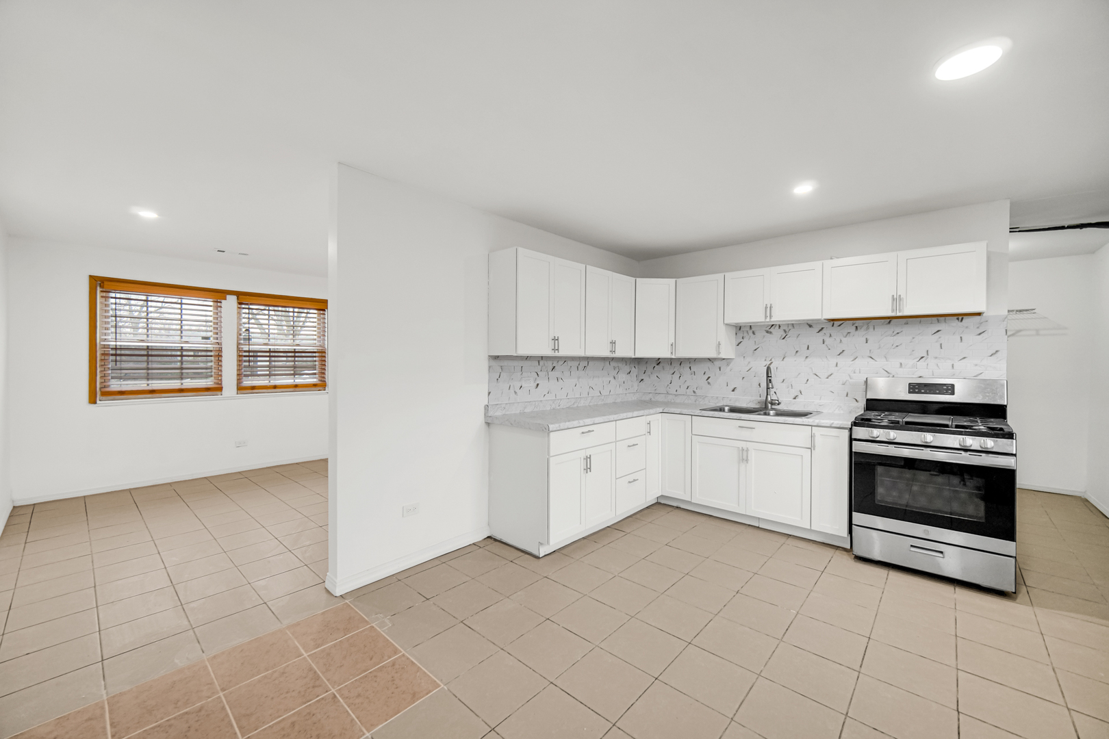 341 Boston Street North Chicago Heights, IL 60411 - Photo 4 of 13 a kitchen with cabinets and appliances