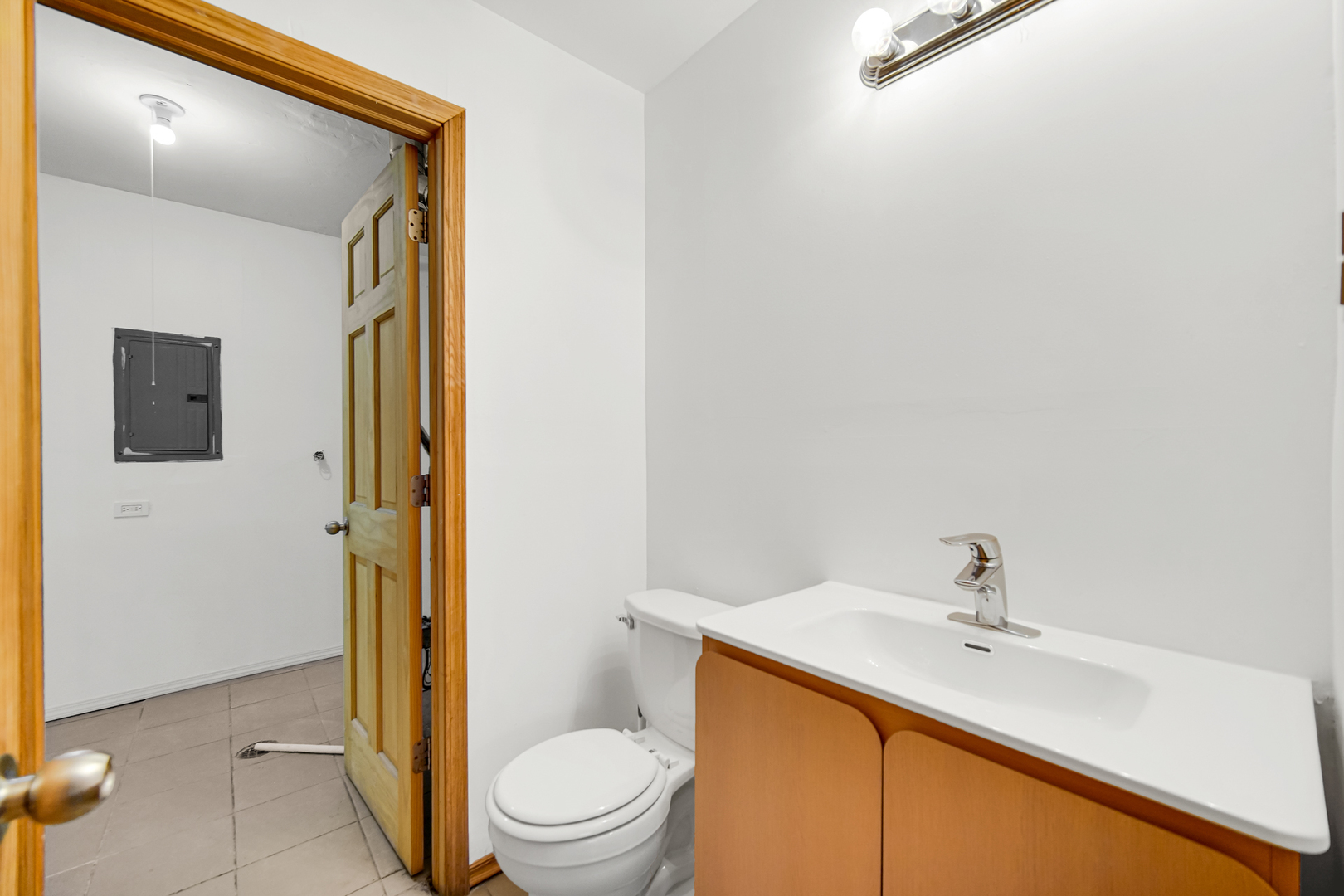 341 Boston Street North Chicago Heights, IL 60411 - Photo 9 of 13 a bathroom with a sink toilet and shower