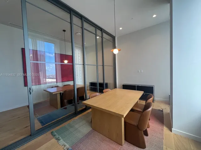 a kitchen that has a stove and a table