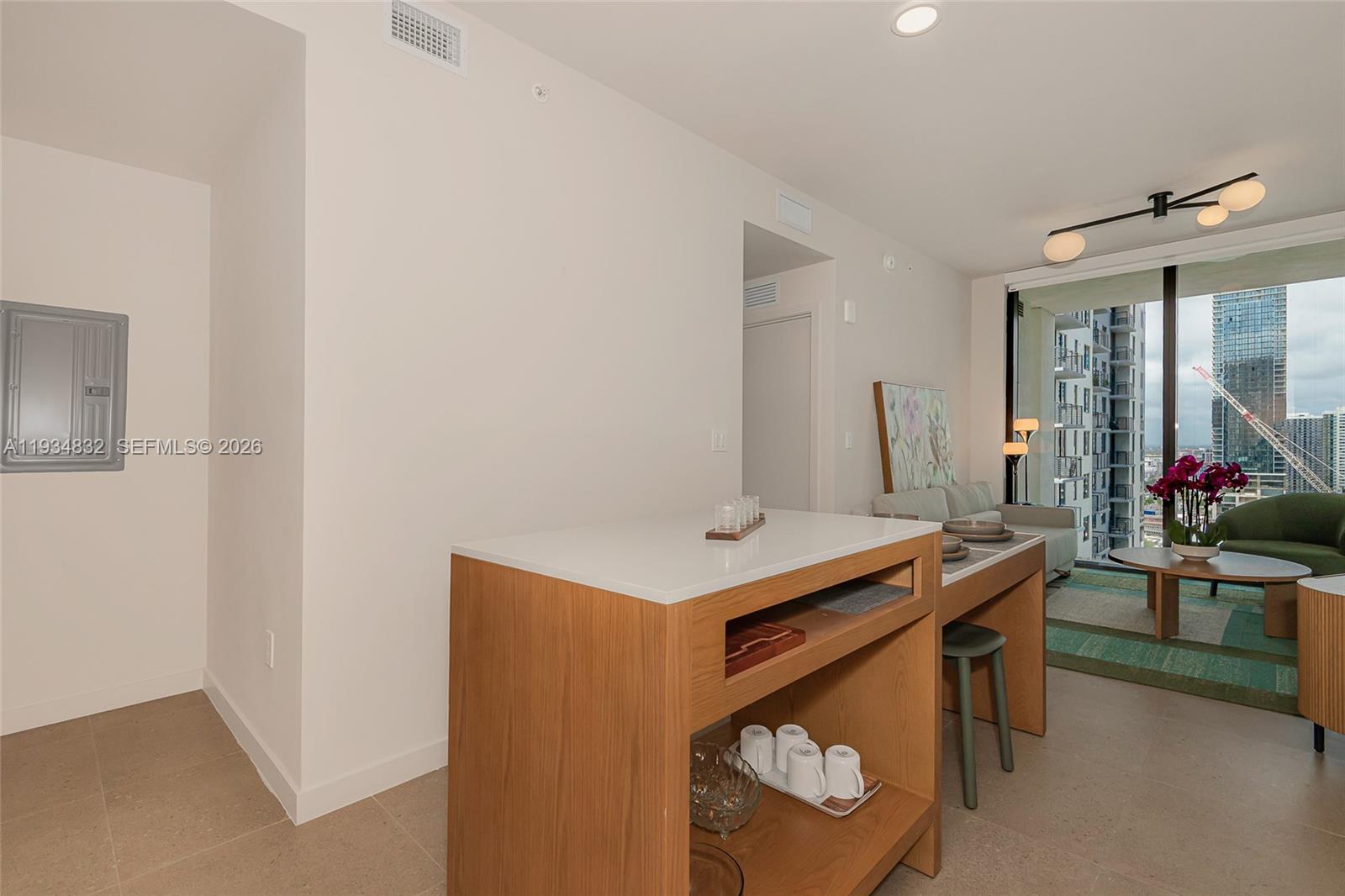 11 Northeast 6th Street, Unit 2709 Miami, FL 33132 - Photo 15 of 39 a room with furniture and a potted plant