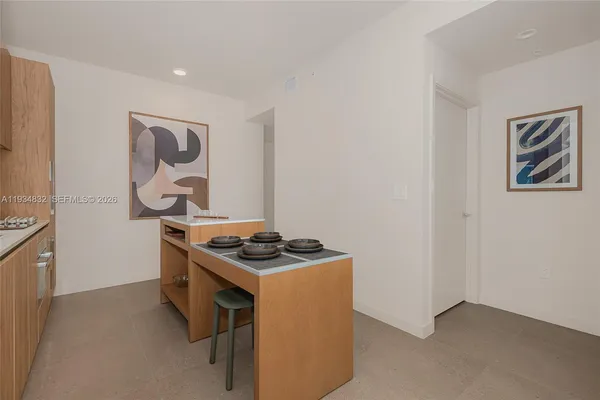 a kitchen that has a stove and a table in it