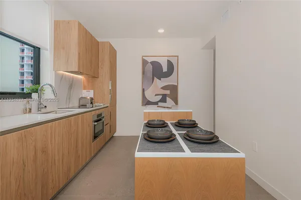 a kitchen with a stove and a sink