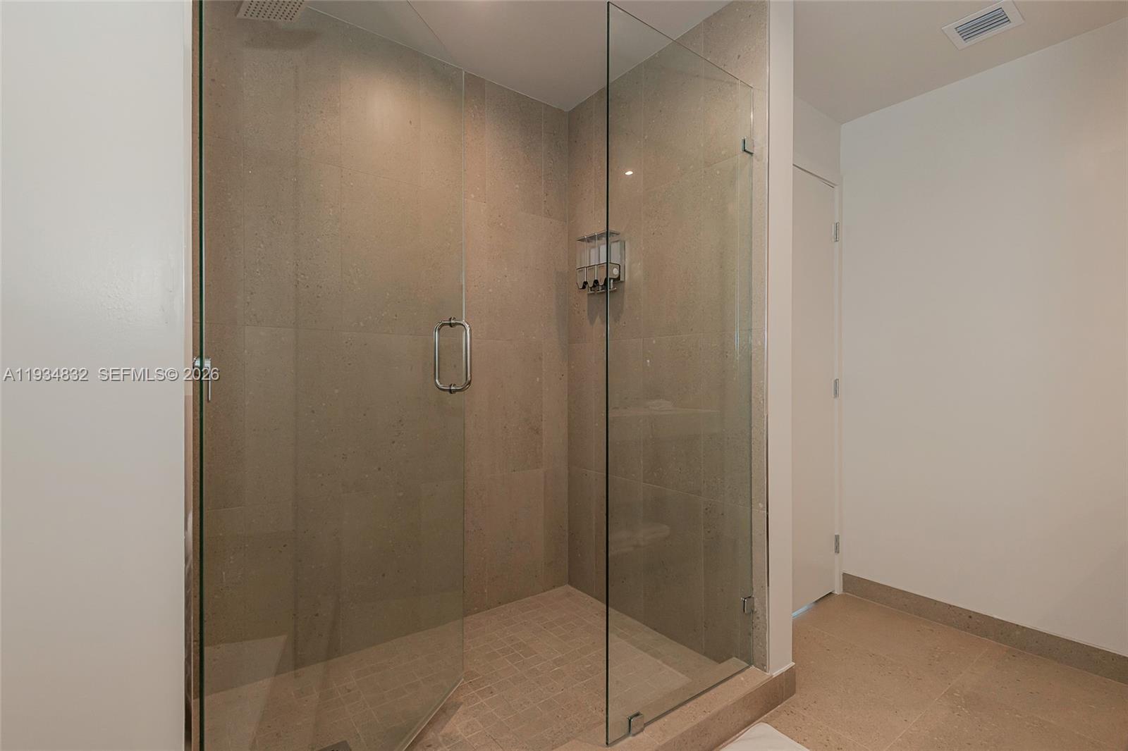 11 Northeast 6th Street, Unit 2709 Miami, FL 33132 - Photo 29 of 39 a bathroom with a shower