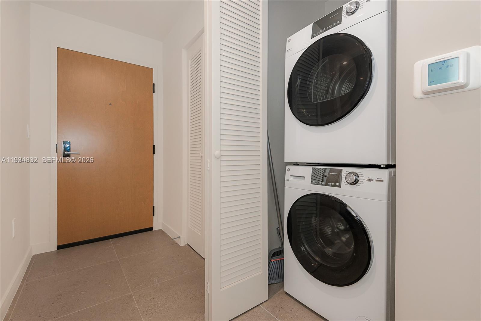 11 Northeast 6th Street, Unit 2709 Miami, FL 33132 - Photo 34 of 39 a view of a hallway with washer and dryer