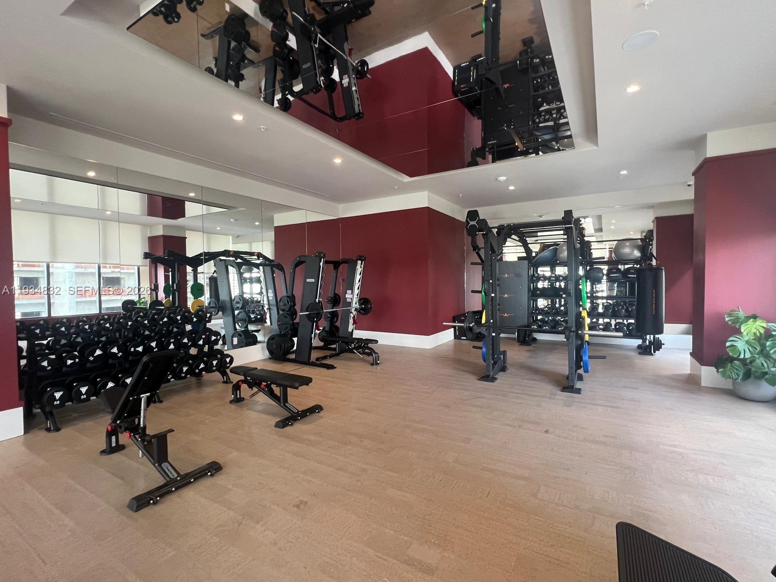 11 Northeast 6th Street, Unit 2709 Miami, FL 33132 - Photo 8 of 39 a view of a room with gym equipment