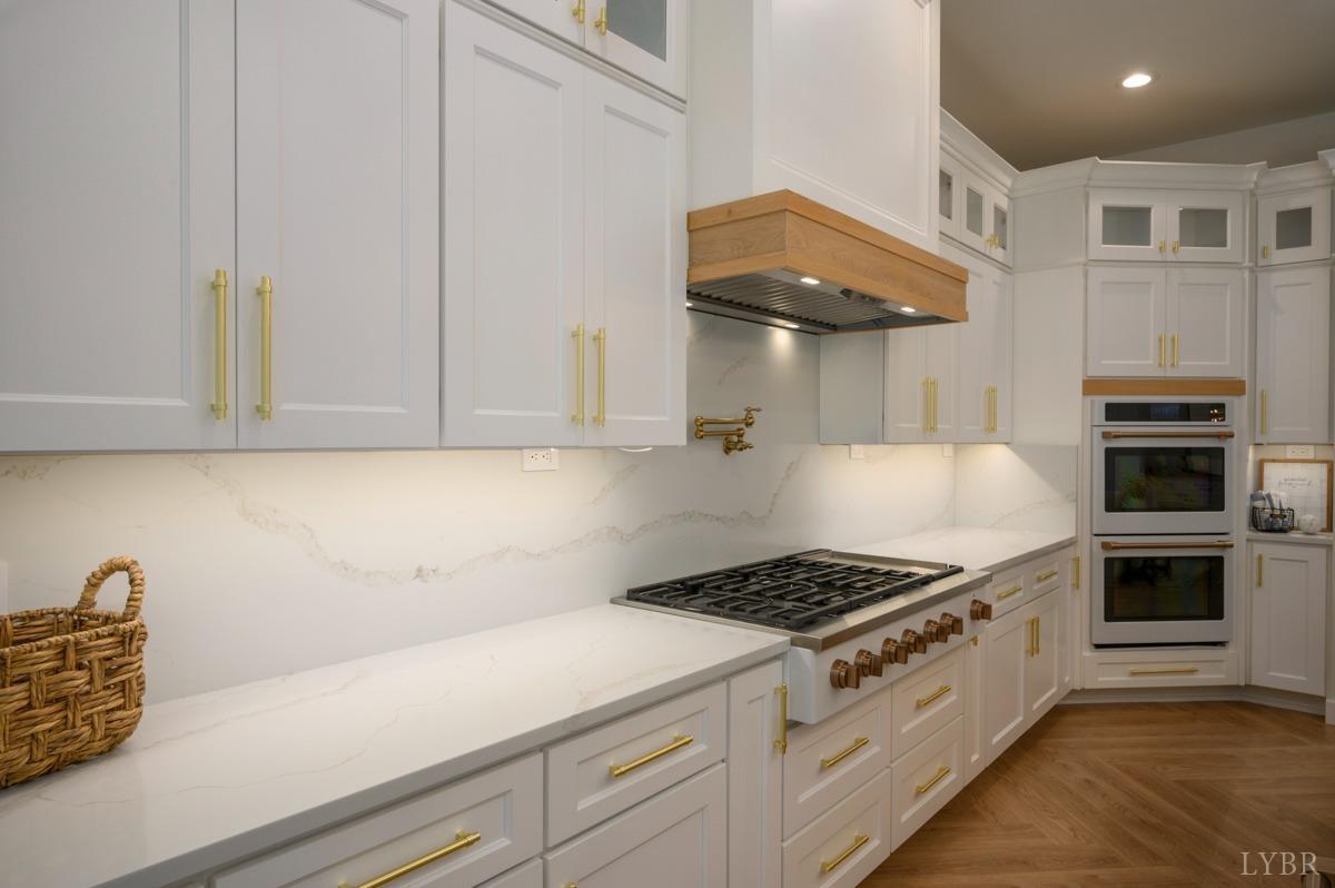 12175 Forest Road Forest, VA 24551 - Photo 16 of 75 a kitchen with stainless steel appliances a stove and white cabinets