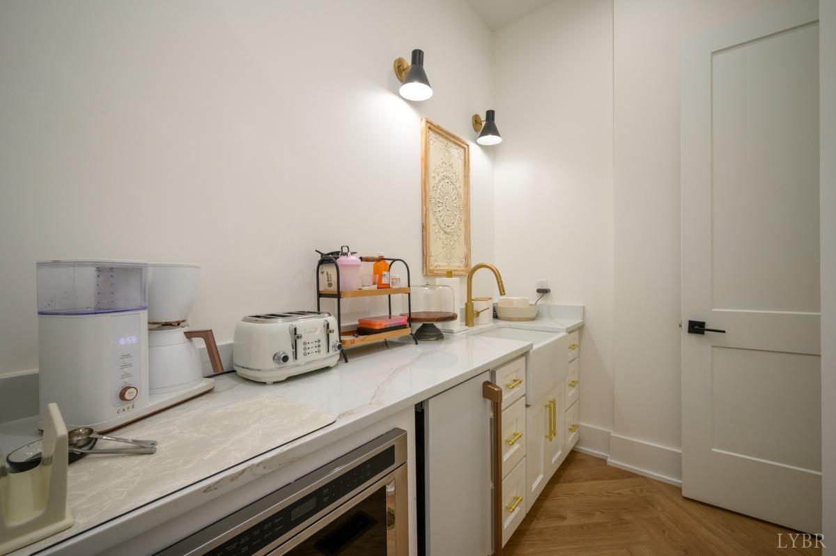 12175 Forest Road Forest, VA 24551 - Photo 18 of 75 a kitchen with a sink cabinets and wooden floor