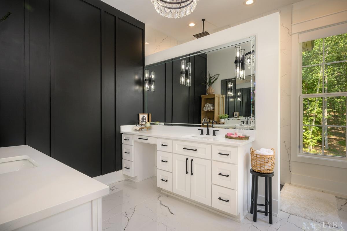 12175 Forest Road Forest, VA 24551 - Photo 26 of 75 a bathroom with a double vanity sink a and a mirror