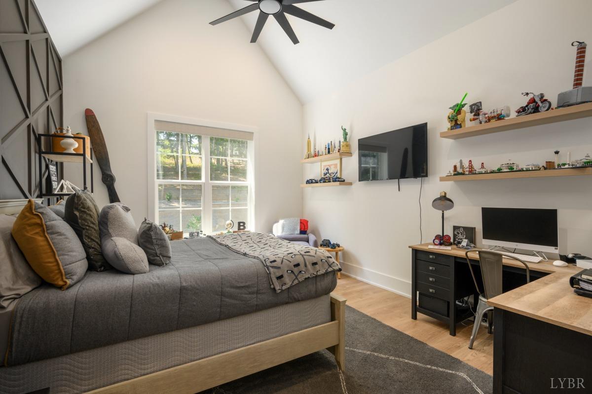 12175 Forest Road Forest, VA 24551 - Photo 38 of 75 a bedroom with a bed and a flat screen tv