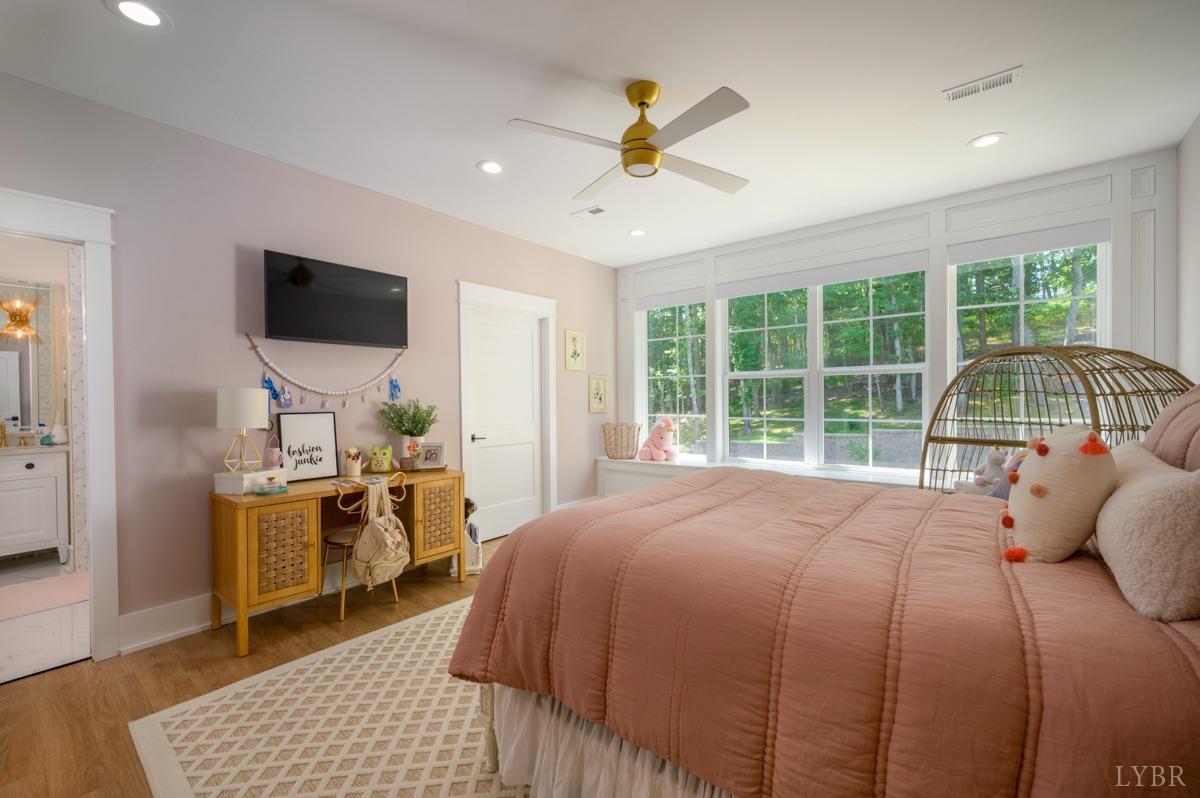 12175 Forest Road Forest, VA 24551 - Photo 40 of 75 a bedroom with a bed and a flat screen tv