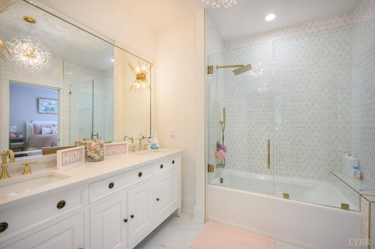 12175 Forest Road Forest, VA 24551 - Photo 42 of 75 a bathroom with a tub a sink double and mirror