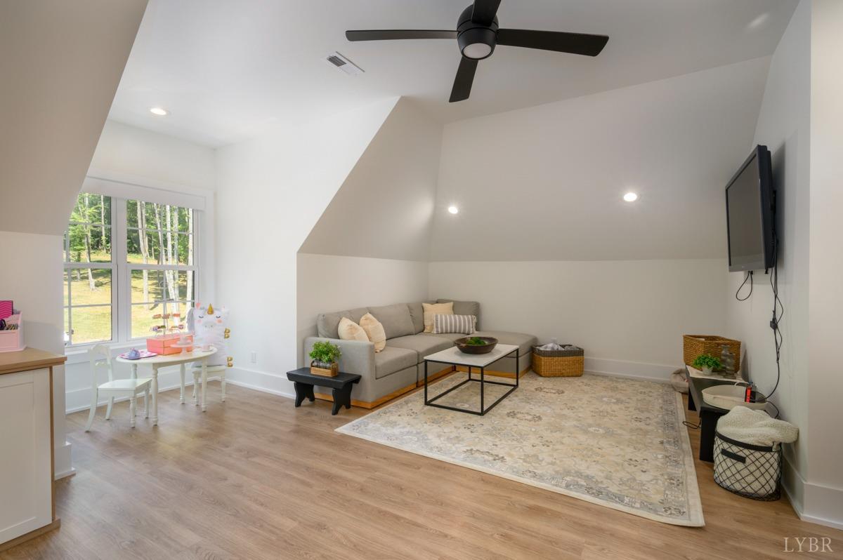 12175 Forest Road Forest, VA 24551 - Photo 49 of 75 a living room with furniture and a flat screen tv