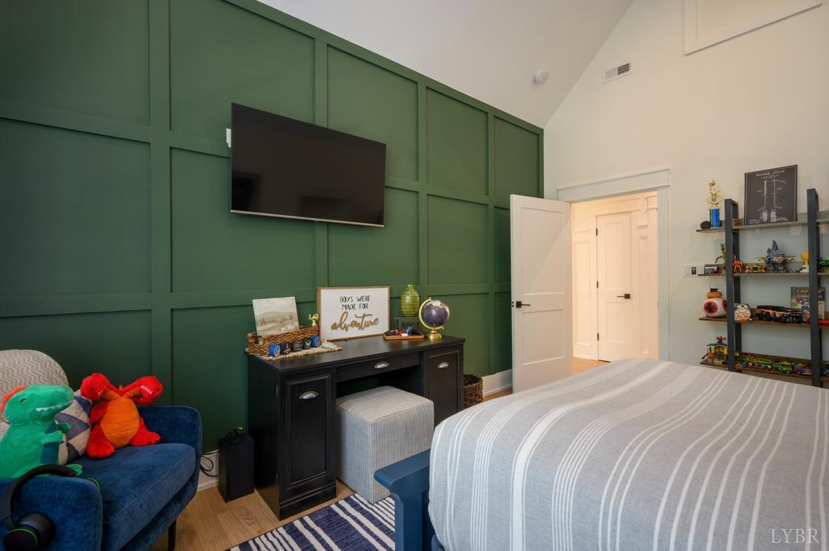 12175 Forest Road Forest, VA 24551 - Photo 52 of 75 a bedroom with a bed and flat screen tv