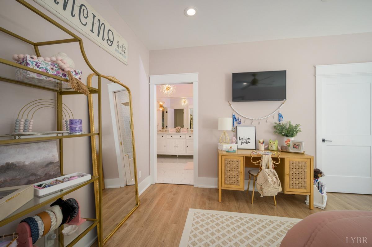12175 Forest Road Forest, VA 24551 - Photo 53 of 75 a living room with furniture a flat screen tv and a floor to ceiling window