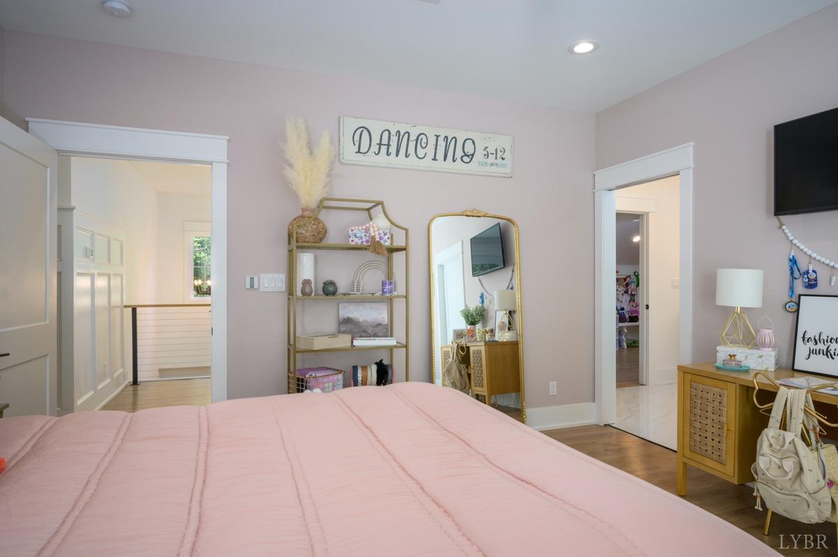 12175 Forest Road Forest, VA 24551 - Photo 54 of 75 a bedroom with a bed and a flat tv screen on dresser