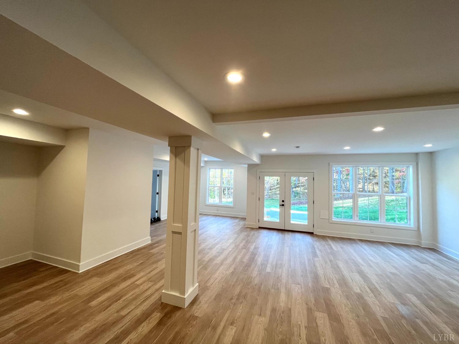 12175 Forest Road Forest, VA 24551 - Photo 73 of 75 an empty room with wooden floor and windows