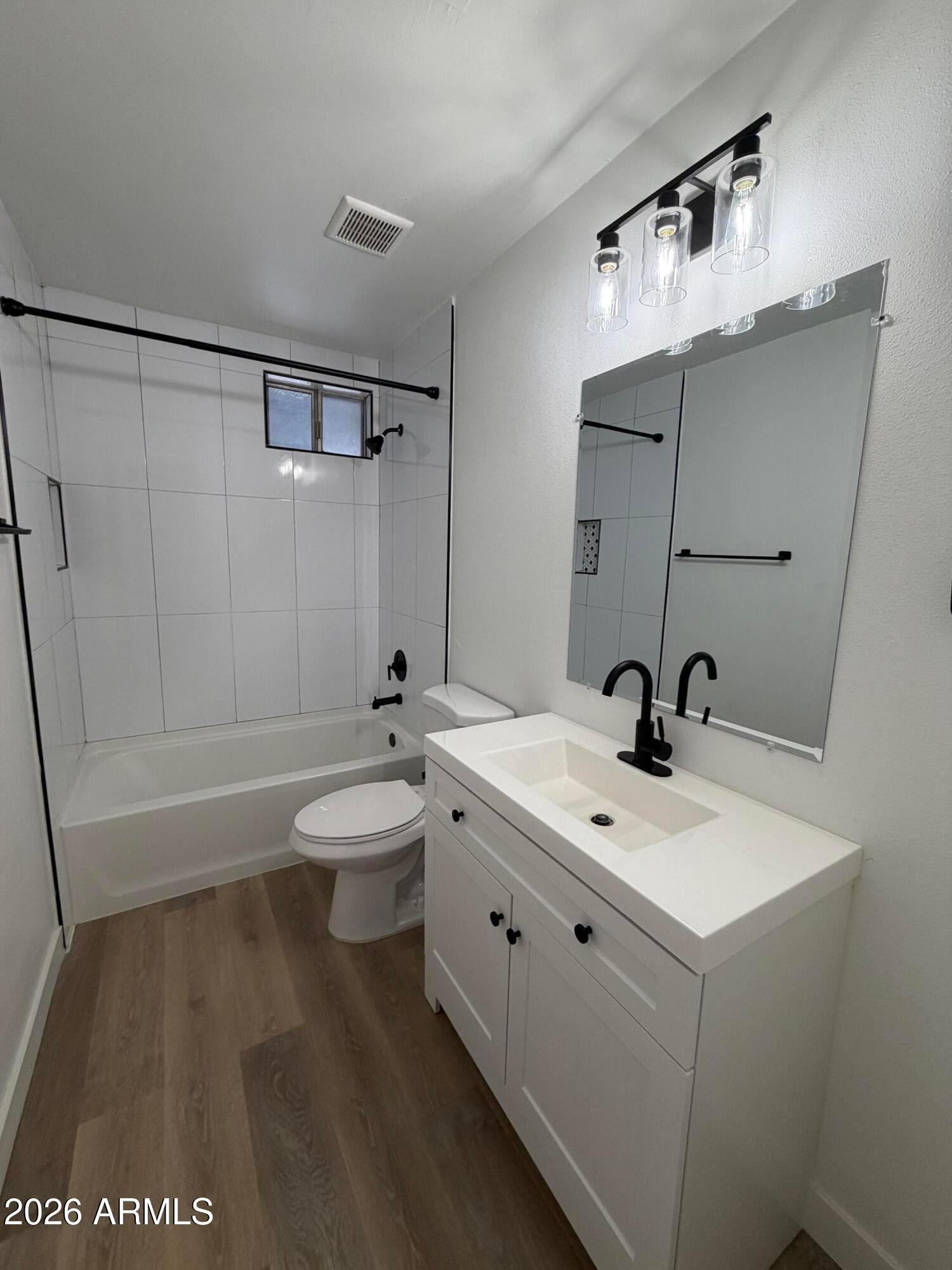 302 East Monte Vista Road, Unit A5 Phoenix, AZ 85004 - Photo 11 of 23 a bathroom with a sink a toilet and shower